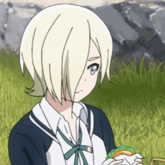 a girl with white hair and blue eyes is eating a sandwich