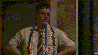 a man wearing glasses and a scarf around his neck says wacht even van binsbergen nog een zo 'n opmerking