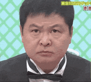 a man in a tuxedo and bow tie is making a funny face