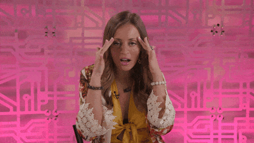 a woman with her hands on her head is wearing a pearl bracelet and a gold ring