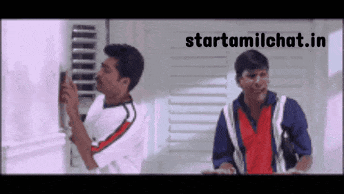 a couple of men standing next to each other with the words starttamilchat.in above them