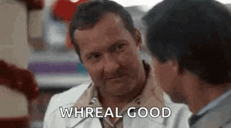 two men are talking to each other in a store and one of them is saying `` whreal good '' .