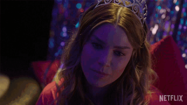 a woman wearing a tiara and a netflix logo in the corner