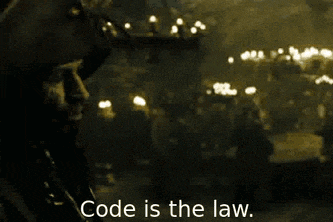 a man talking on a cell phone with the words code is the law written below him
