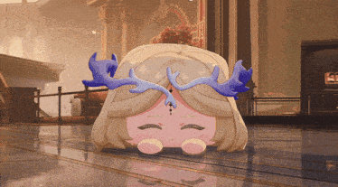 a cartoon character with antlers on her head is laying down