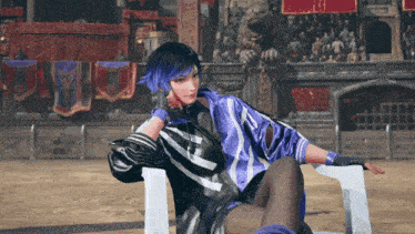 a woman with purple hair is sitting in a chair in front of a crowd