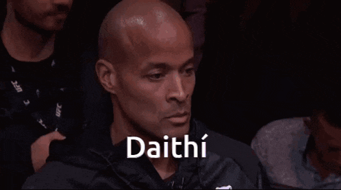 a man in a black jacket with the word daithi on his face