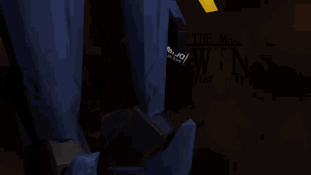 a close up of a blue and yellow robot with the letters jd on the bottom right