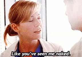 a woman in a lab coat is talking to a man and says " like you ve seen me naked "