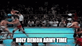 a group of men are fighting in a boxing ring with the words holy demon army time written on the bottom .