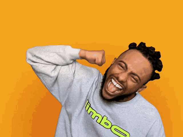 a man wearing a sweatshirt that says limbo is laughing