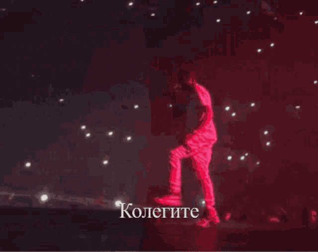 a blurred image of a crowd with the word kolegite on the bottom right