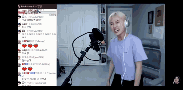 a man wearing headphones stands in front of a microphone on a screen that says ly a ( answer )