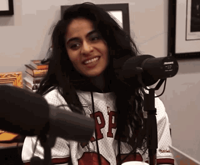 a woman wearing a jersey that says pp on it
