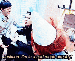 jackson is in a bad mood already while wearing a birthday hat