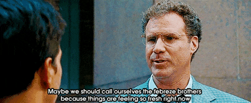 a man in a suit and glasses is talking to another man and says maybe we should call ourselves the febreze brothers