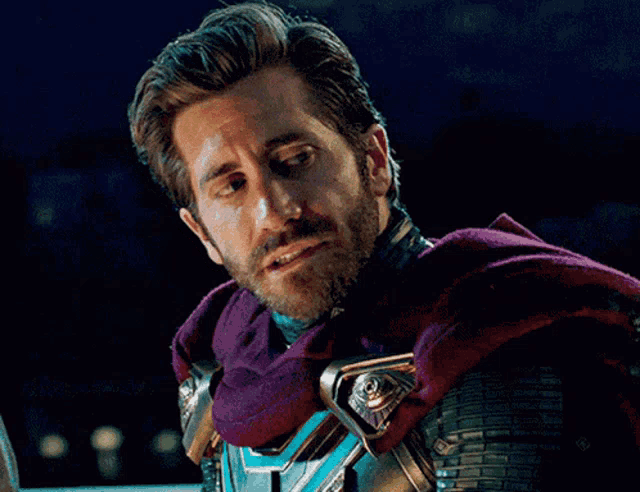 a man with a beard is wearing a purple cape and armor