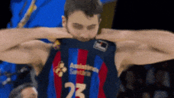 a basketball player wearing a number 23 jersey