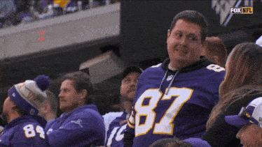 a man wearing a jersey with the number 87