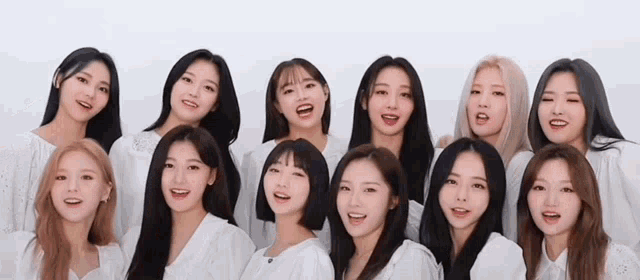 a group of young women are posing for a picture and smiling .