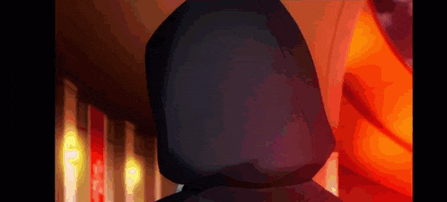 a person with a hood on their head is standing in front of a red background .
