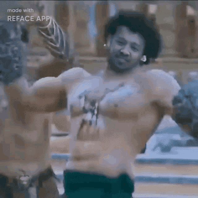 a shirtless man with huge muscles is standing in front of a group of people .