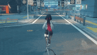 a woman is riding a scooter down a street with a sign that says ' a ' on it