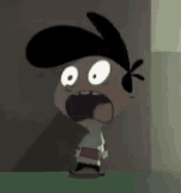 a cartoon character is standing next to a wall with his mouth wide open .