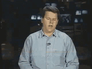 a man in a blue shirt is vomiting into a tie