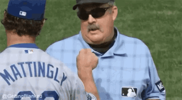 a baseball player with the name mattingly on the back of his shirt