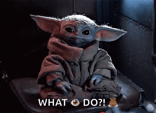 a baby yoda from star wars is sitting on a cushion and asking what do ?
