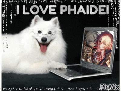 a picture of a dog laying next to a laptop that says i love phaidei