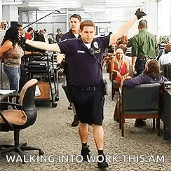 a man in a police uniform is walking into a room with his arms outstretched .