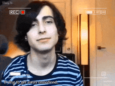 a video of a young man is being recorded with the words trying to get away unnoticed
