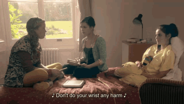 three women sit on a bed with the words " don 't do your wrist any harm "