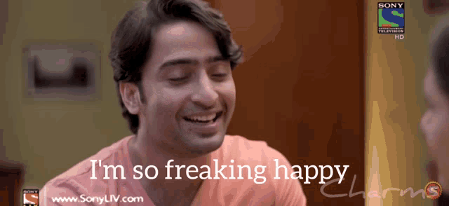 a man is smiling with the words " i 'm so freaking happy " above him