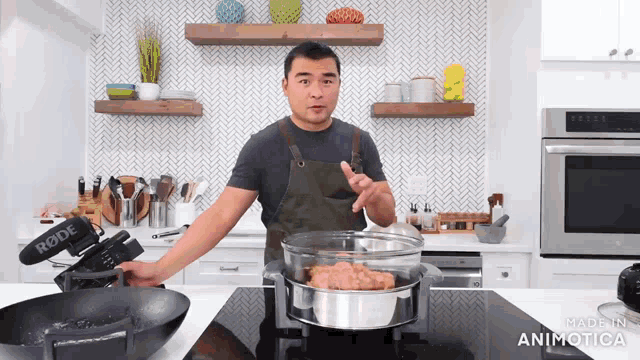 a man in a kitchen cooking with a rode camera