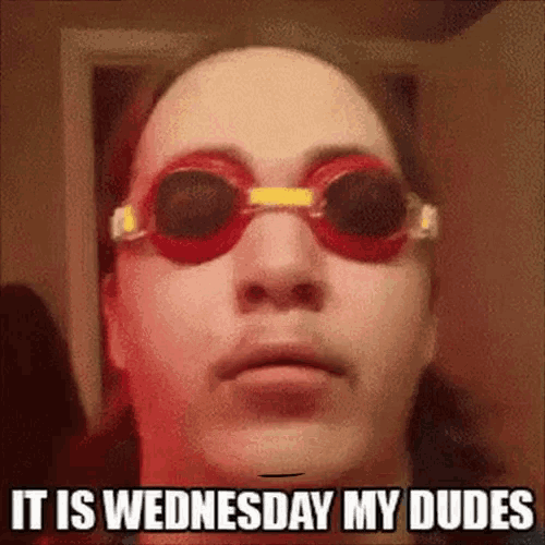 a woman wearing swimming goggles with the words it is wednesday my dudes on her face