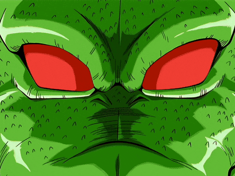 a green cartoon character with red eyes and a mouth