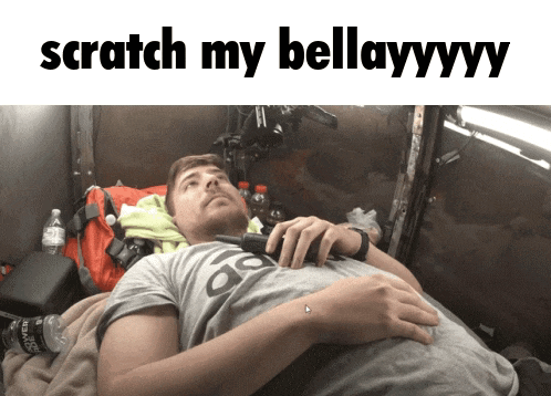 a man laying down with the words scratch my bellayyy