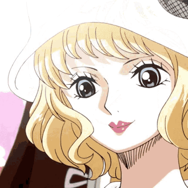 a close up of a woman 's face with a hat on