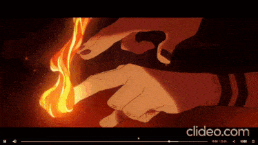 a video is being played on clideo.com and shows a hand holding a torch