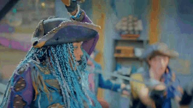 a girl with blue braids is wearing a pirate hat and holding a sword in her hand .
