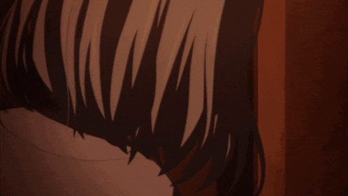 a girl with chinese writing on her face looks at another girl