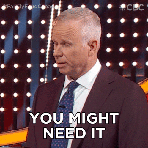 a man in a suit and tie is saying " you might need it "