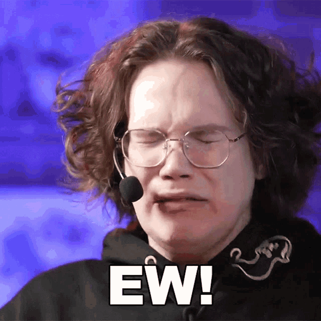 a man wearing glasses and a microphone has the word ew written on his face