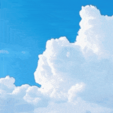 a large white cloud in a blue sky .