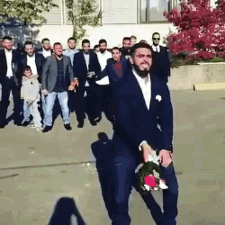Mens Bouquet Toss GIF - Bouquet Groom Wedding GIFs