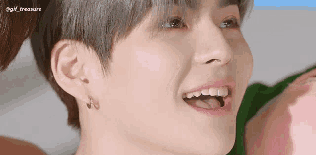 a close up of a person 's face with the words gif_treasure written on the bottom