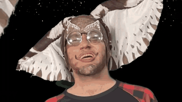 a man wearing glasses and a gremlins costume